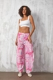 A wholesale clothing model wears fan10509-pink-mango-fabric-patterned-pareo-trousers, Turkish wholesale  of 