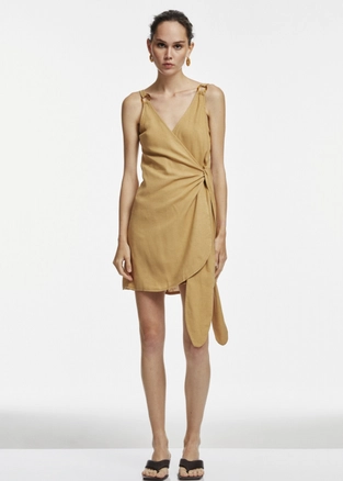 A model wears 17299 - Ring Detailed Mini Dress - Camel, wholesale Dress of Fk.Pynappel to display at Lonca