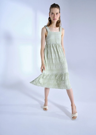 A model wears 28443 - Strapless Gofre Midi Length Dress - Almond Green, wholesale Dress of Fk.Pynappel to display at Lonca
