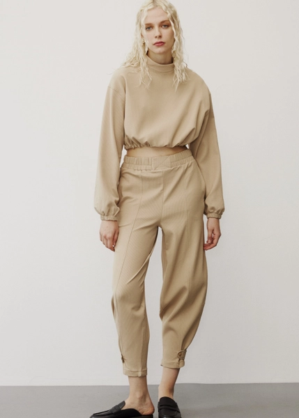 A model wears 31758 - Tracksuit - Beige, wholesale Tracksuit of Fk.Pynappel to display at Lonca
