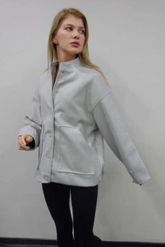 A wholesale clothing model wears flw10073-bomber-stamp-jacket-gray, Turkish wholesale Jacket of Flow