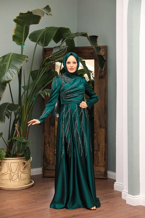 A model wears 47321 - Evening Dress - Emerald Green, wholesale Dress of Hulya Keser to display at Lonca