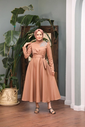 A model wears 47339 - Evening Dress - Camel, wholesale Dress of Hulya Keser to display at Lonca