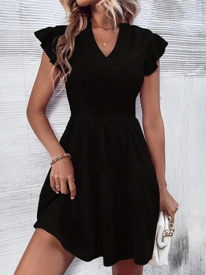 A wholesale clothing model wears jan13816-women's-short-sleeve-sleeve-ruffle-aerobin-mini-dress-black, Turkish wholesale Dress of Janes