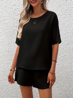 A wholesale clothing model wears jan13846-women's-short-sleeve-crew-neck-casual-waffle-blouse-shorts-set-black, Turkish wholesale Blouse of Janes