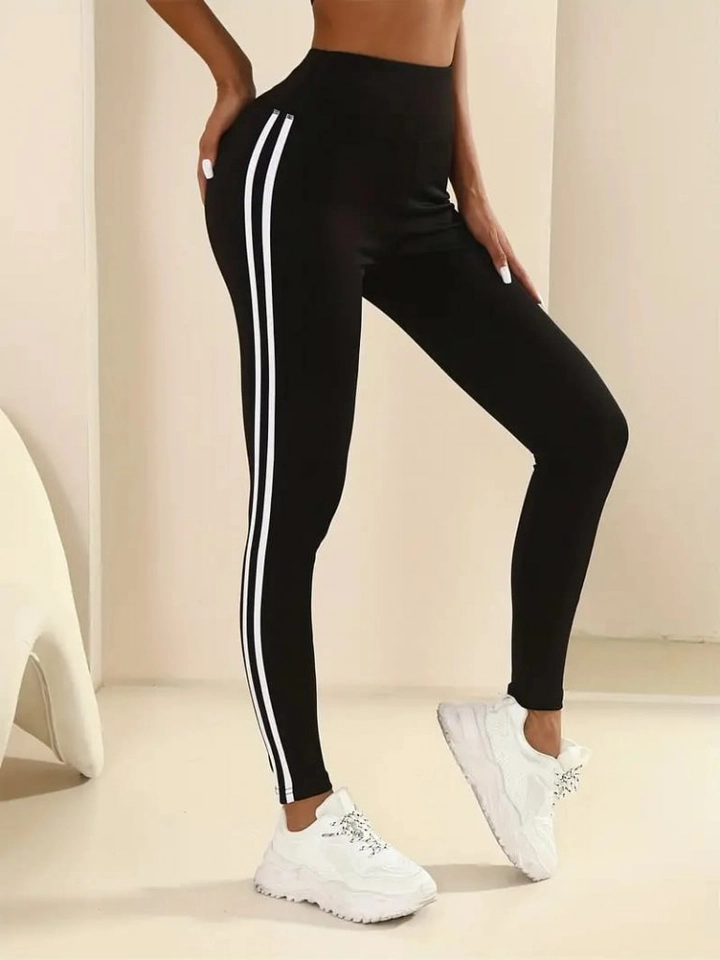 A wholesale clothing model wears jan14305-women's-diving-tights-with-double-white-stripes-on-the-sides-black, Turkish wholesale Leggings of Janes