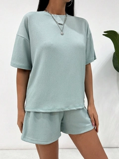 A wholesale clothing model wears jan14491-women's-light-gray-gimped-suprem-and-lined-shorts-set-gray, Turkish wholesale Suit of Janes