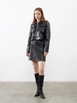 A wholesale clothing model wears jst10259-patterned-leather-pocket-cover-mini-skirt-black, Turkish wholesale  of 