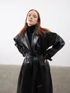A wholesale clothing model wears jst10264-patterned-leather-belted-trench-coat-black, Turkish wholesale Trenchcoat of Juste