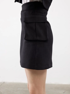 A wholesale clothing model wears jst10293-velvet-pocket-detail-mini-skirt-black, Turkish wholesale Skirt of Juste