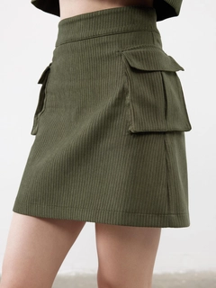 A wholesale clothing model wears jst10302-velvet-pocket-detail-mini-skirt-khaki, Turkish wholesale Skirt of Juste