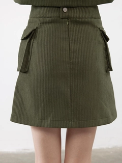 A wholesale clothing model wears jst10302-velvet-pocket-detail-mini-skirt-khaki, Turkish wholesale Skirt of Juste