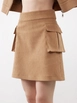 A wholesale clothing model wears jst10303-velvet-pocket-detail-mini-skirt-beige, Turkish wholesale  of 