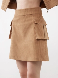 A wholesale clothing model wears jst10303-velvet-pocket-detail-mini-skirt-beige, Turkish wholesale Skirt of Juste