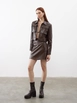 A wholesale clothing model wears jst10191-patterned-leather-pocket-cover-mini-skirt-brown, Turkish wholesale  of 
