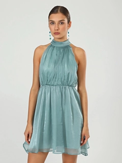 A wholesale clothing model wears jst10202-organza-halter-neck-green-dress, Turkish wholesale Dress of Juste