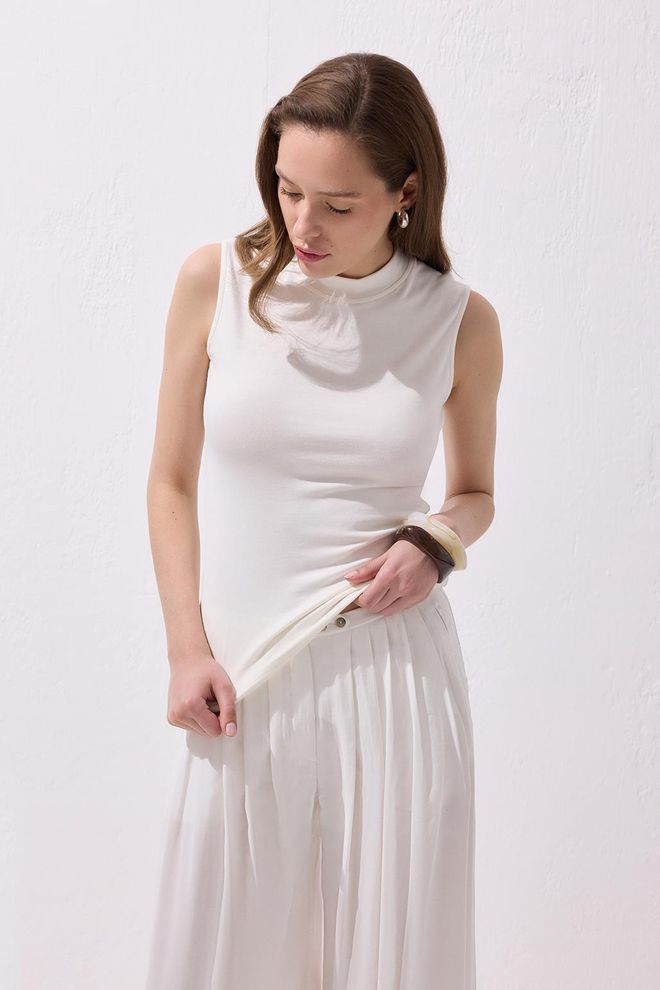 Kadriye Baştürk بلوزة من القطن القابل للتمدد بدون أكمام إكرو ملابس بالجملة ربيع