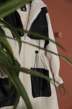 A wholesale clothing model wears kam11571-leather-fabric-garni-detail-jacquard-women's-trench-coat-beige, Turkish wholesale Trenchcoat of Kaktus Moda