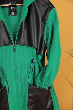 A wholesale clothing model wears kam11569-leather-fabric-garni-detail-jacquard-women's-trench-coat-green, Turkish wholesale Trenchcoat of Kaktus Moda