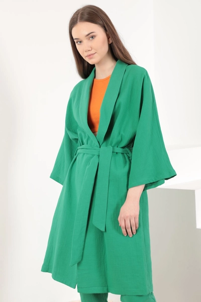 A model wears KAM10837 - Muslin Fabric Oversize Women's Kimono - Green, wholesale Kimono of Kaktus Moda to display at Lonca