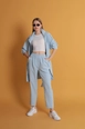 Una modelo de ropa al por mayor lleva kam11684-atlas-fabric-women's-trousers-with-elastic-waist-baby-blue,  turco al por mayor de 
