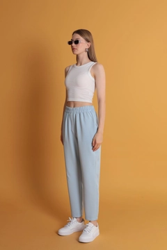 A wholesale clothing model wears kam11684-atlas-fabric-women's-trousers-with-elastic-waist-baby-blue, Turkish wholesale Pants of Kaktus Moda