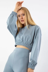 A model wears 24092 - Blouse - Baby Blue, wholesale undefined of Kaktus Moda to display at Lonca