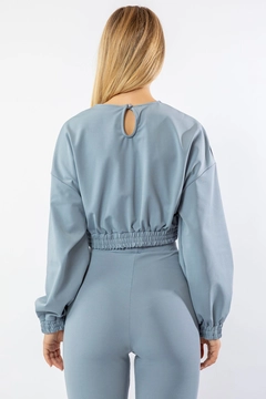 Ein Bekleidungsmodell aus dem Großhandel trägt 24092 - Blouse - Baby Blue, türkischer Großhandel Bluse von Kaktus Moda