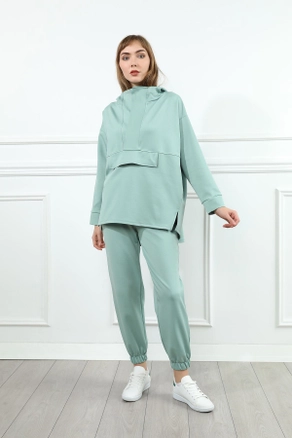 A model wears 23163 - Tracksuit - Mint Green, wholesale Tracksuit of Kaktus Moda to display at Lonca