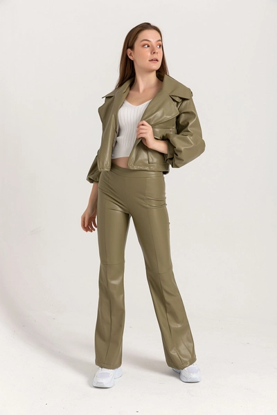 A model wears 23509 - Pants - Khaki, wholesale Pants of Kaktus Moda to display at Lonca