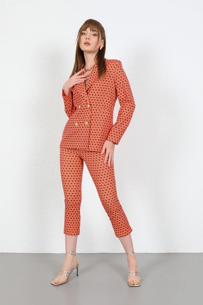 A model wears 23615 - Pants - Orange, wholesale Pants of Kaktus Moda to display at Lonca