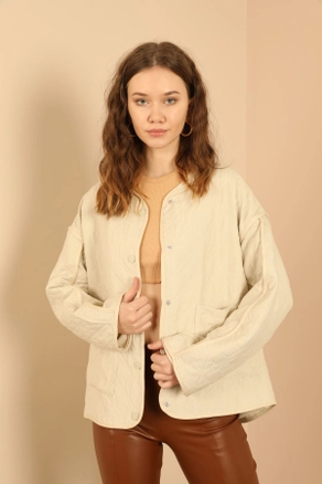 A model wears 35594 - Jacket - Stone, wholesale undefined of Kaktus Moda to display at Lonca