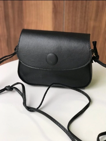 A model wears KUX10029 - Kuxo Button Detailed Shoulder Bag, wholesale Bag of Kuxo to display at Lonca