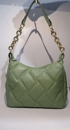 A model wears 40120 - 55 Shoulder Bag, wholesale Bag of Kuxo to display at Lonca