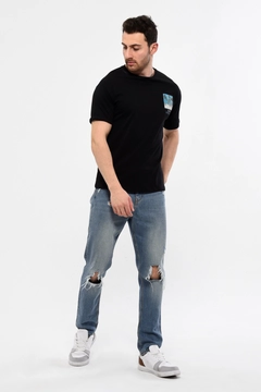 A wholesale clothing model wears 44218 - KUXO Unisex Black Back And Front Printed T-Shirt, Turkish wholesale Tshirt of Kuxo