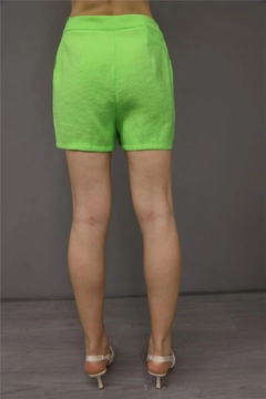 A wholesale clothing model wears lfn11456-shorts-pistachio-green, Turkish wholesale Shorts of Lefon
