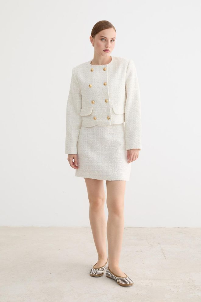 Levure Jupe Mini Blanche Élégante Coupe A Avec Poche À Rabat Vêtements en gros Ancien