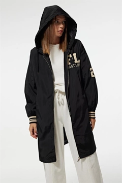 A wholesale clothing model wears lev10025-hooded-long-women's-college-trench-coat-black, Turkish wholesale Trenchcoat of Levure