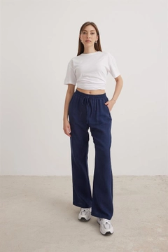 A wholesale clothing model wears lev10210-muslin-loose-women's-trousers-navy-blue, Turkish wholesale Pants of Levure