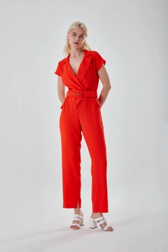 A wholesale clothing model wears MZC10024 - Belted Orange Crepe Jumpsuit - Orange, Turkish wholesale Jumpsuit of MZL Collection