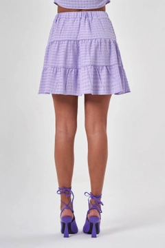 Ένα μοντέλο χονδρικής πώλησης ρούχων φοράει MZC10150 - Skirt - Lilac, τούρκικο Φούστα χονδρικής πώλησης από MZL Collection
