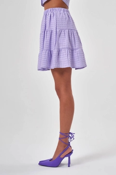 Ένα μοντέλο χονδρικής πώλησης ρούχων φοράει MZC10150 - Skirt - Lilac, τούρκικο Φούστα χονδρικής πώλησης από MZL Collection
