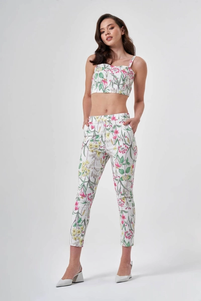 A model wears MZC10187 - Patterned Skinny Leg Colored Trousers - Multicolor, wholesale Pants of MZL Collection to display at Lonca