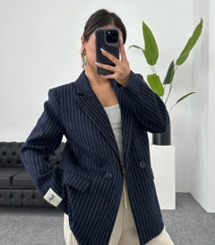 A wholesale clothing model wears 10034-navy-blue-striped-oversize-with-sleeve-label, Turkish wholesale Jacket of Maestro Woman