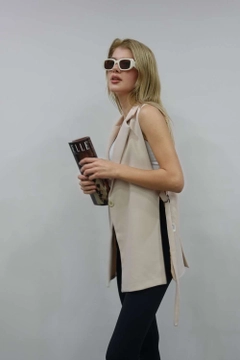 A wholesale clothing model wears 10031-vest-light-beige, Turkish wholesale Vest of Maestro Woman