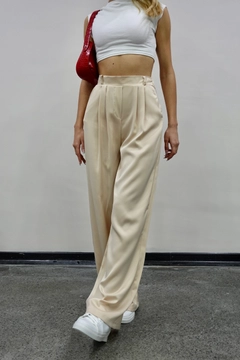 A wholesale clothing model wears mae10049-satin-trousers-beige, Turkish wholesale Pants of Maestro Woman