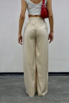A wholesale clothing model wears mae10049-satin-trousers-beige, Turkish wholesale Pants of Maestro Woman