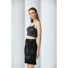 A wholesale clothing model wears 23360 - Pleated Imitation Leather & Embroidery Short Skirt - Black, Turkish wholesale Skirt of Mare Style