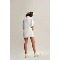Bir model, Mare Style toptan giyim markasının 33209 - Trumpet Sleeve Cotton Mini Embroidery Dress - White toptan Elbise ürününü sergiliyor.