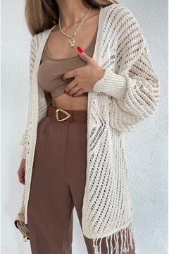 A wholesale clothing model wears max10888-long-cardigan-with-openwork-skirt-and-tassels, Turkish wholesale Cardigan of Maxi Modena